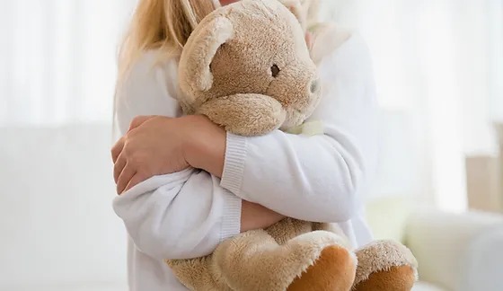 Girl Hugging Tedding Bear